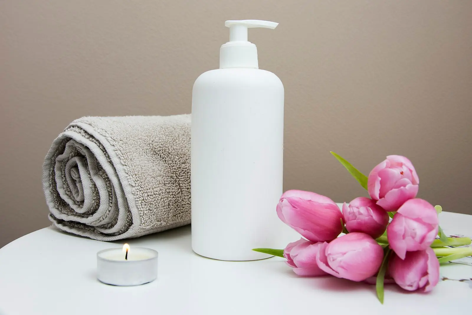 Massage therapy setup with towels and oils
